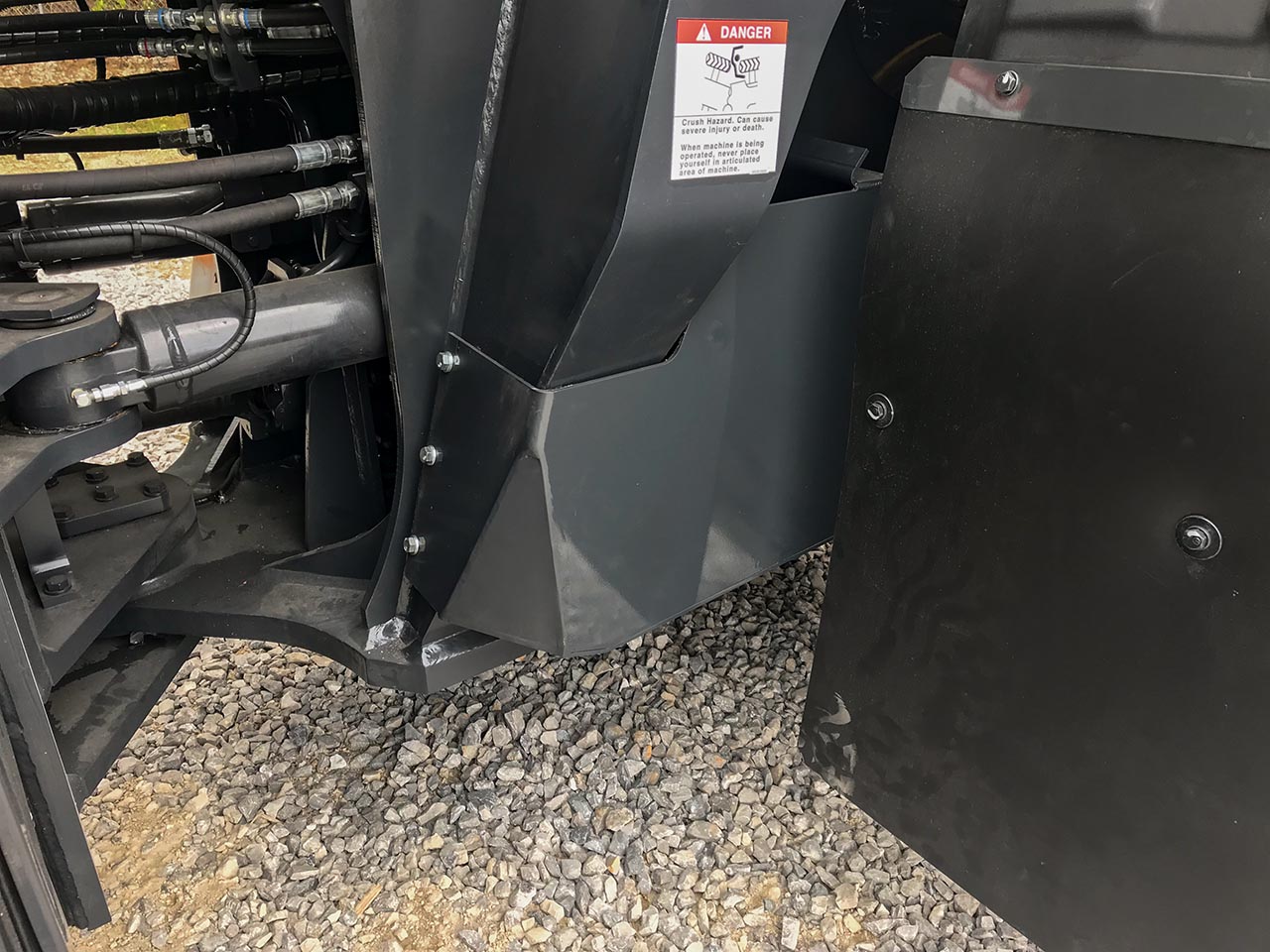 Boom cylinder hose guards
