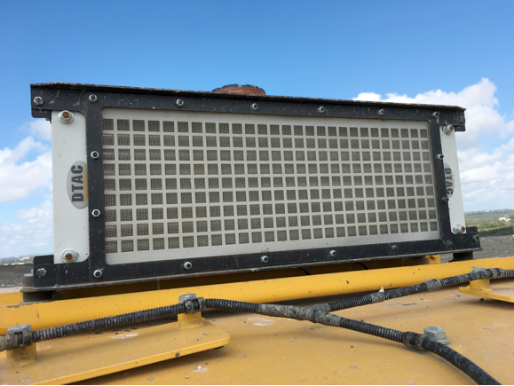 Re-located A/C condenser
