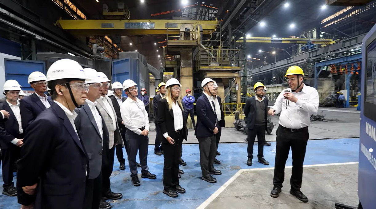 Komatsu employees talking and smiling