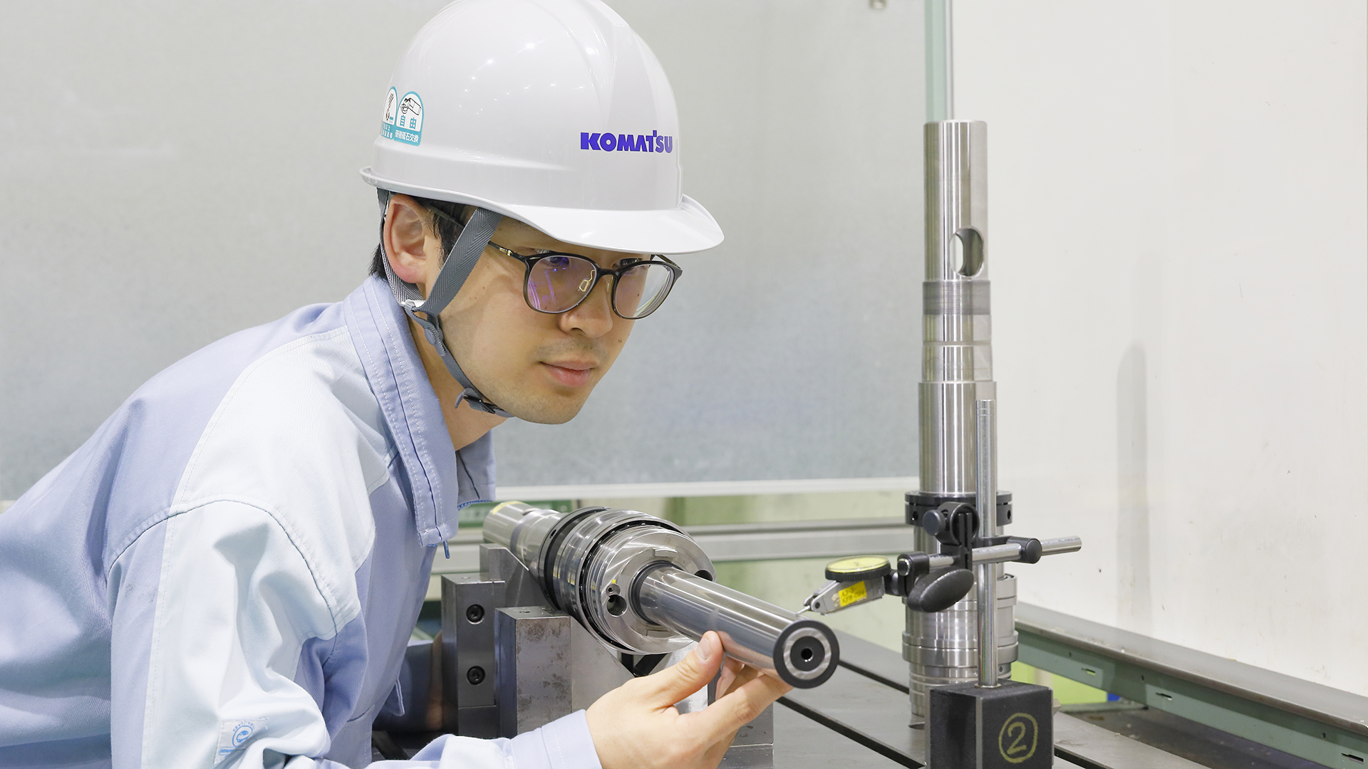Industrial worker inspecting machinery setup