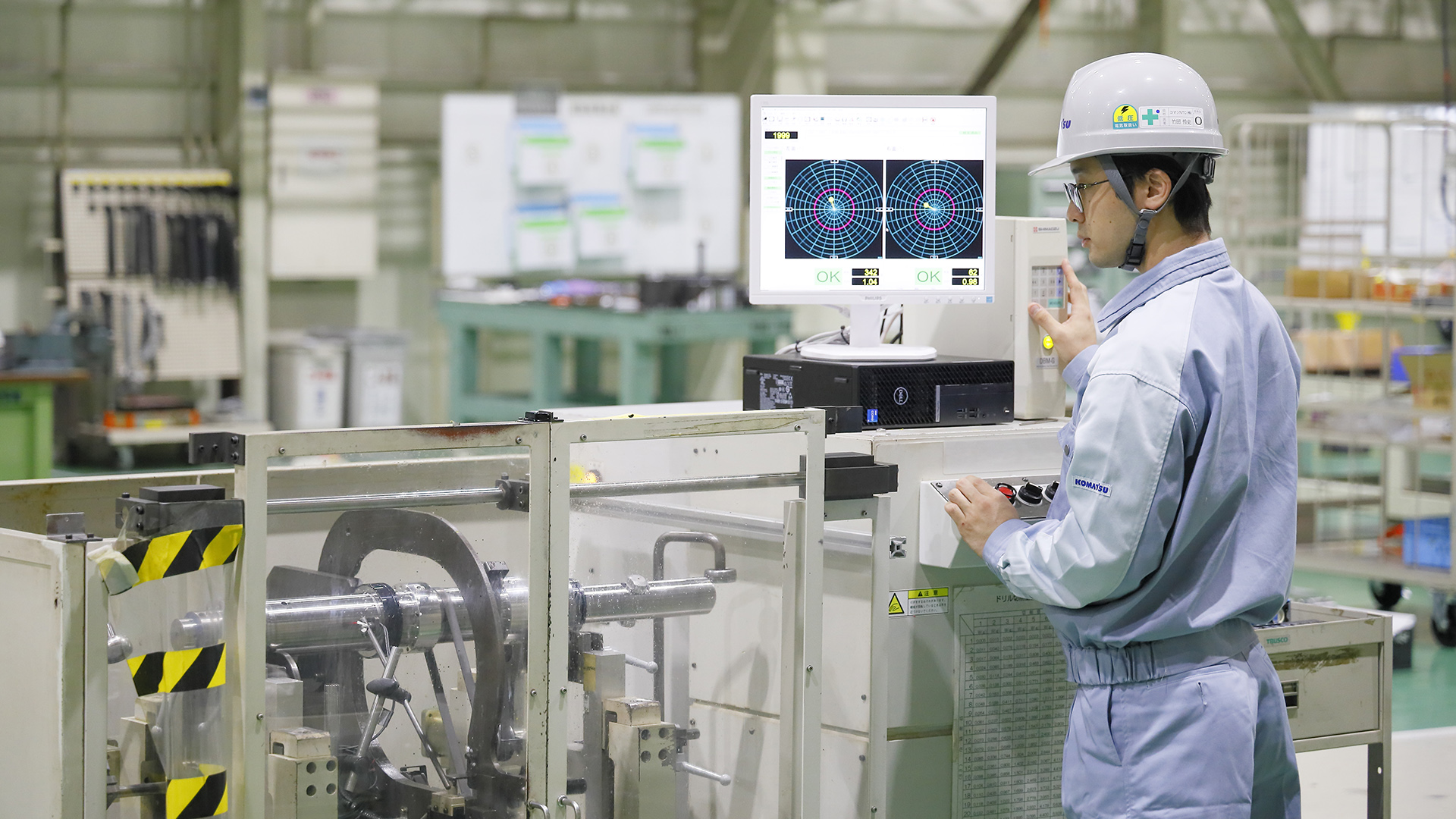 Factory worker operating industrial machinery