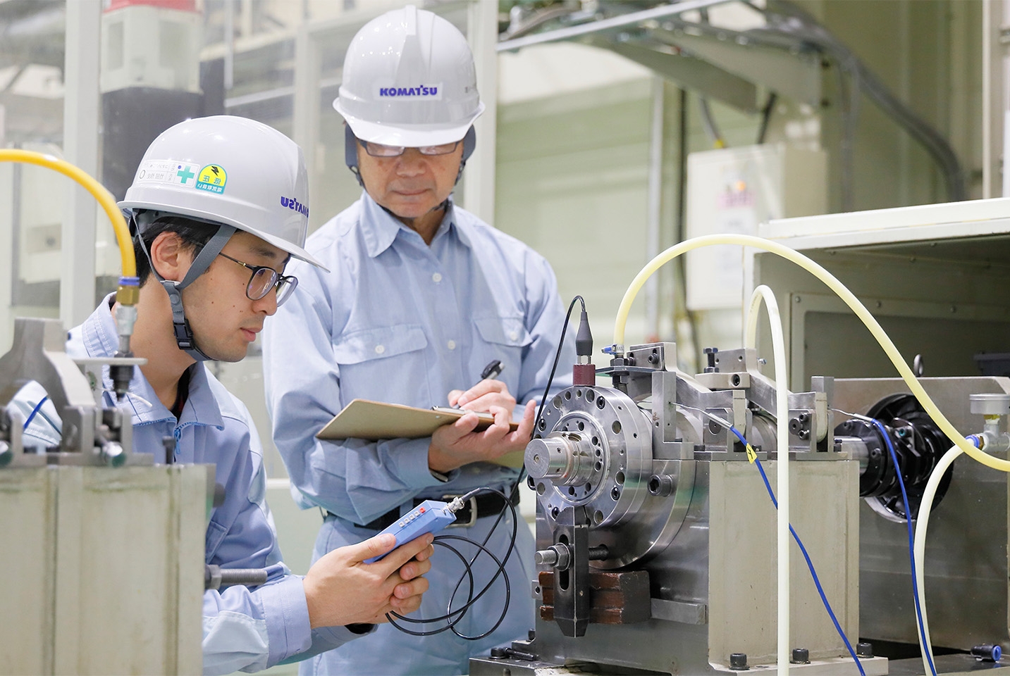 Industrial machinery operation and business meeting