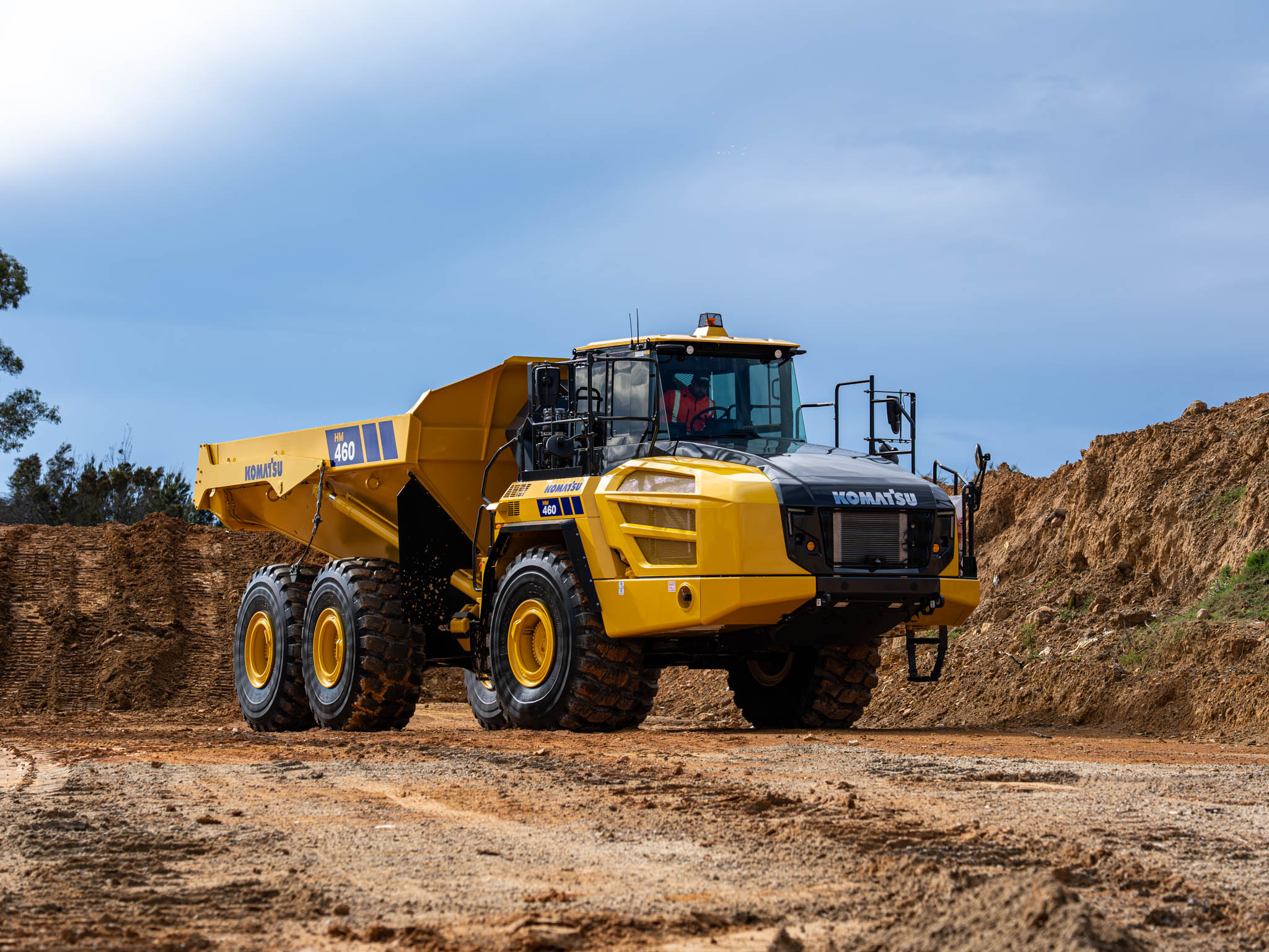 A Komatsu dump truck on a mine or quarry site.