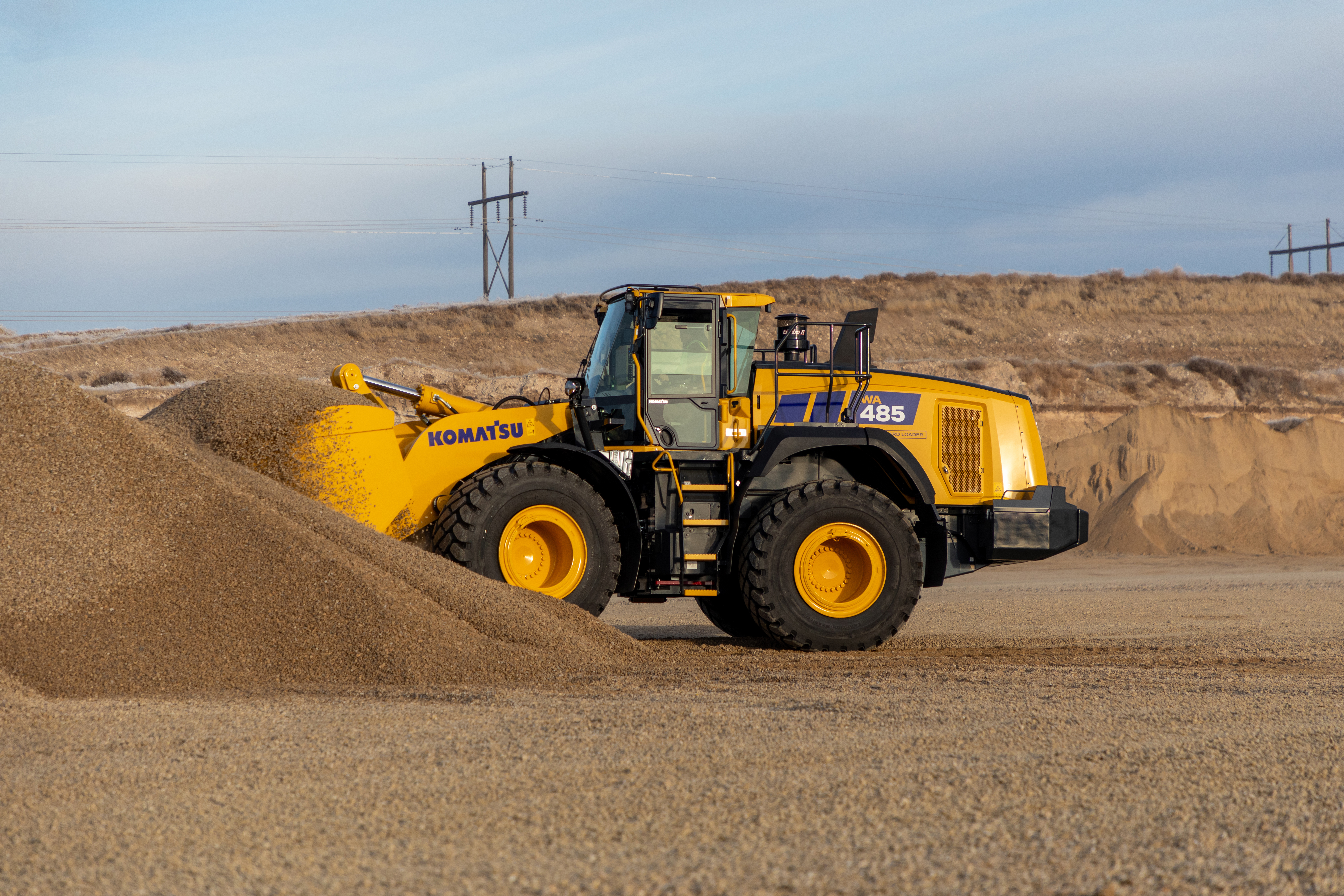 A Komatsu wheel loader on a quarry site.