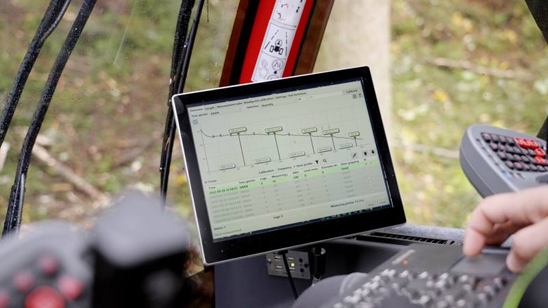 Person checking a laptop displaying calibration information
