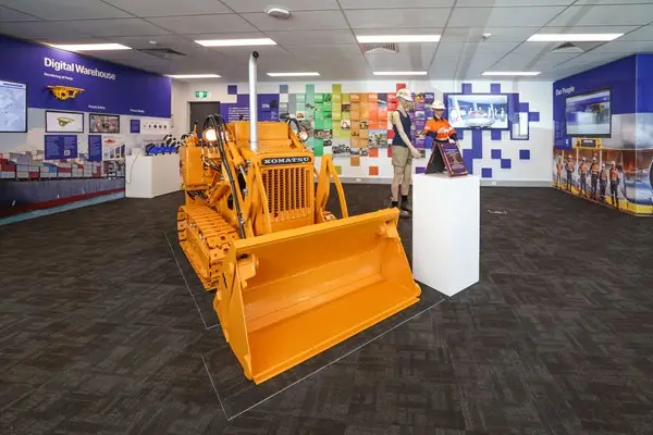 A dozer inside of Innovation Hub Expo Room at Queensland facility