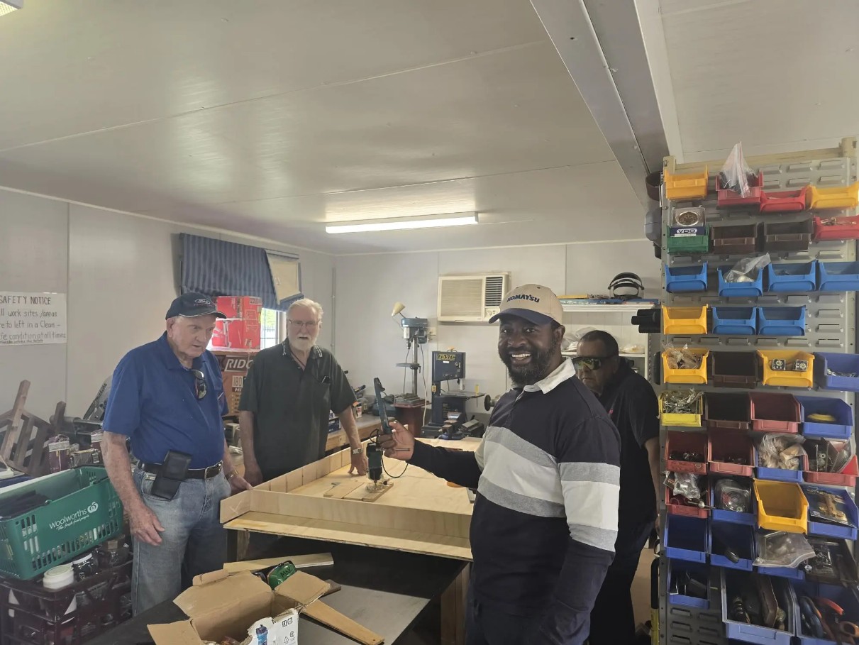 group of men in a workshop