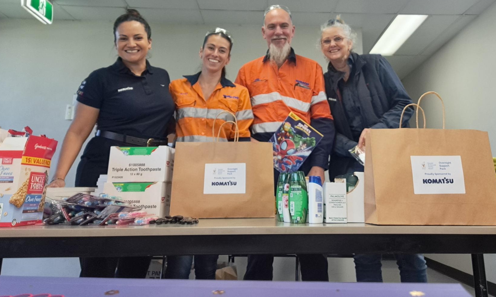 Group at Donation Table with Supplies