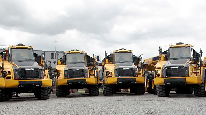 Komatsu trucks in a yard line-up