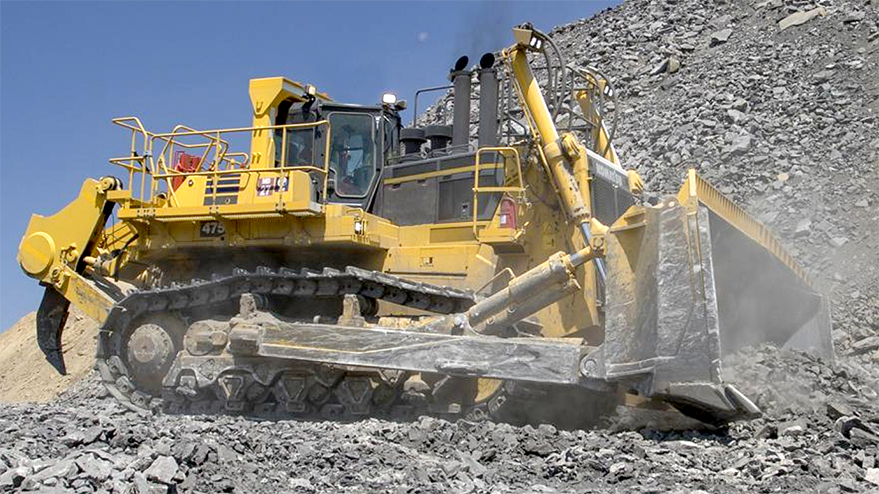 Two technicians next to Komatsu D39PXi dozer