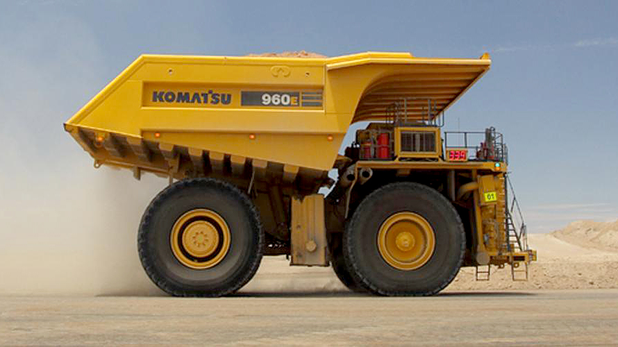 A row of articulated dump truck in a work site in Southern Africa.