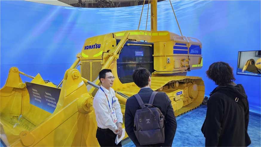 A Komatsu employee explains the company’s vision for underwater construction of the future on Jan. 7 at CES 2025 in Las Vegas. (Photo: Business Wire)